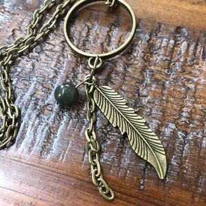 Bronze hoop and feather necklace
